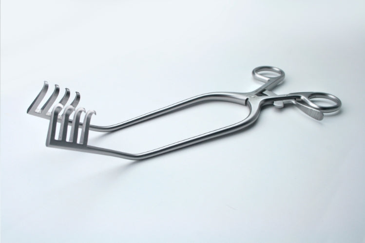 Surgical metal cheek retractor